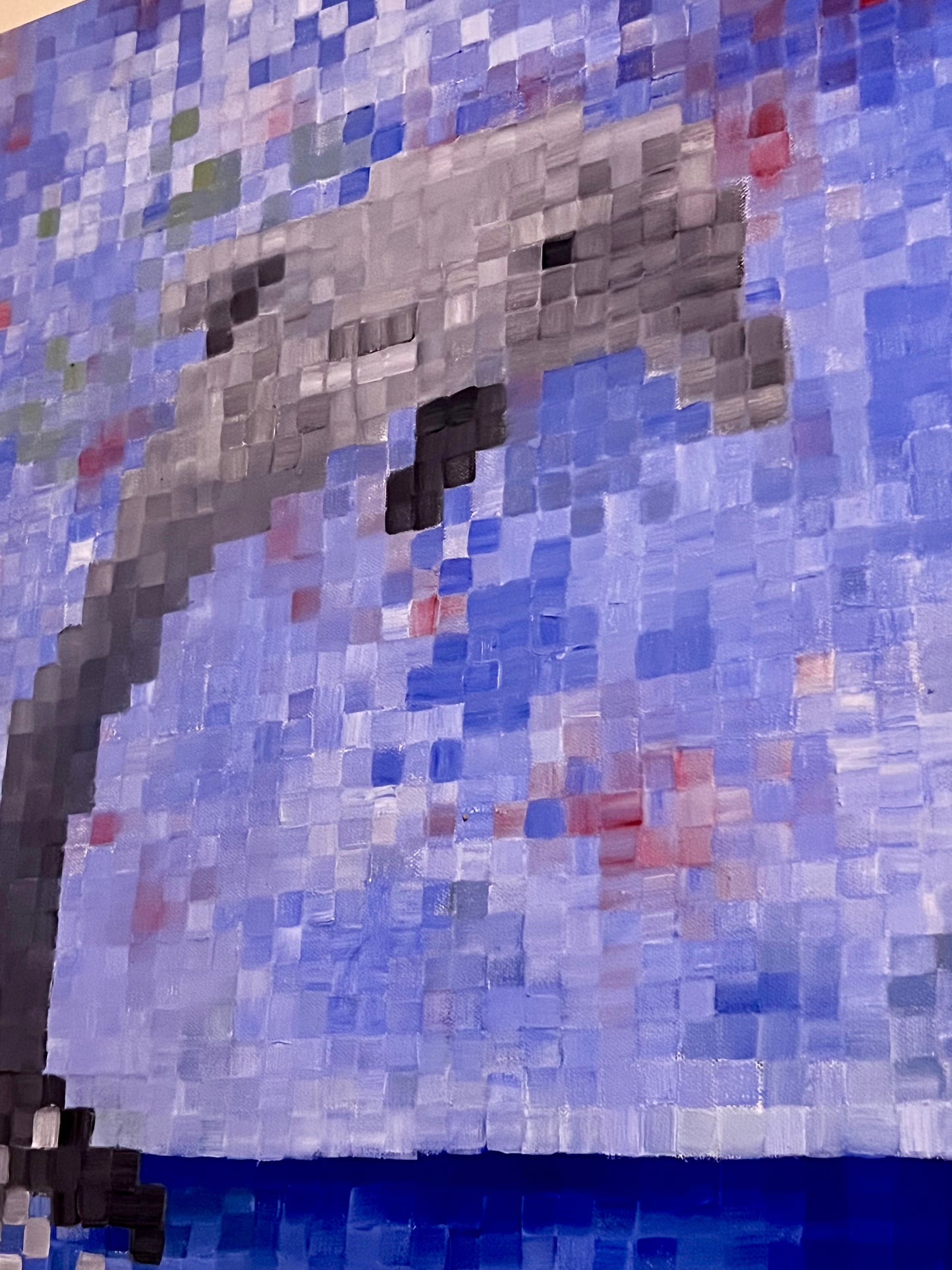 Pixelated dolphin image on a blue background