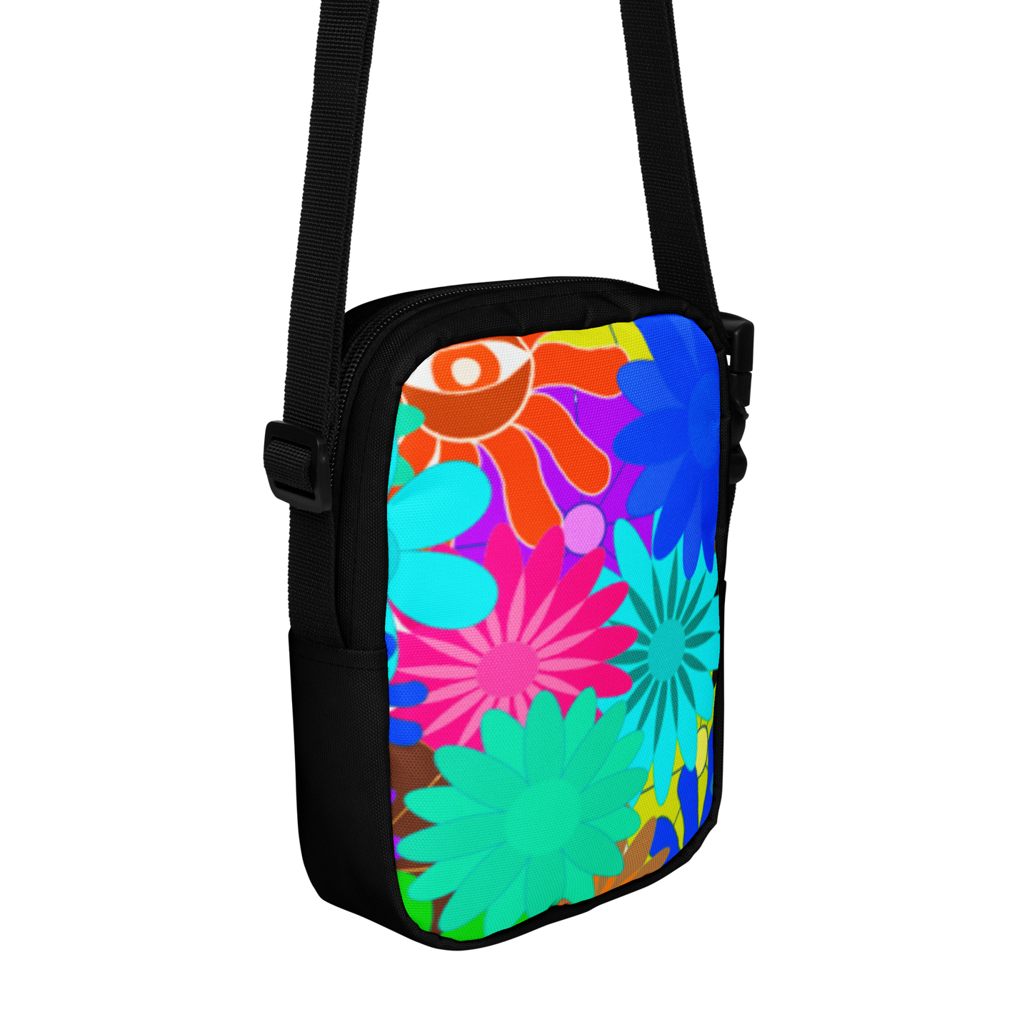 Colorful floral-patterned bag with a black strap on a white background